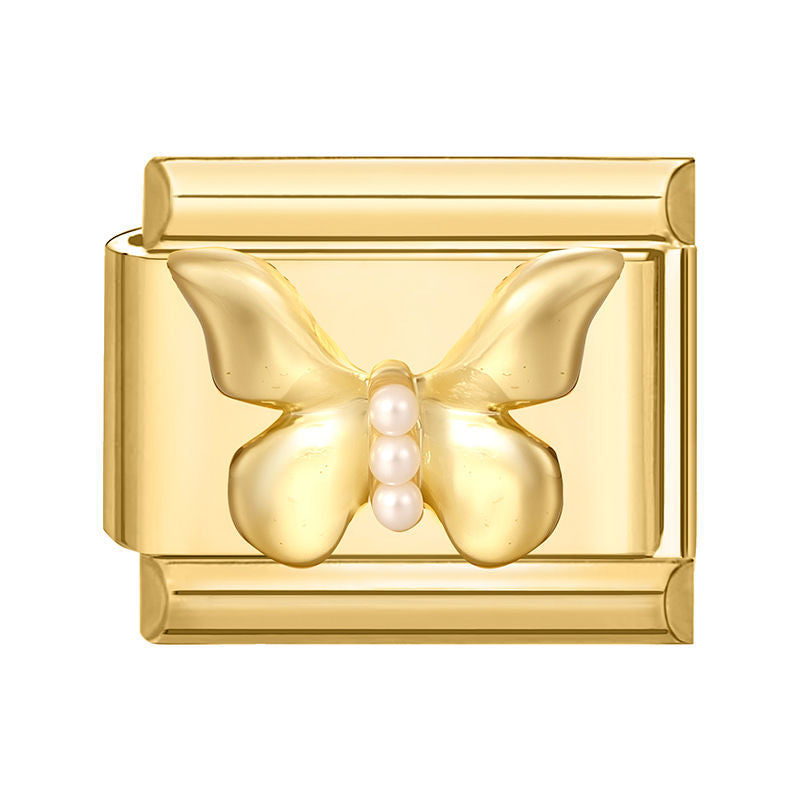 Mariposa dorada con perlas
