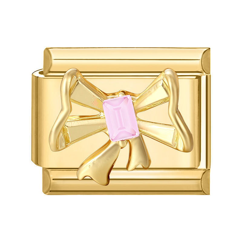 Lazo dorado con piedra rosa