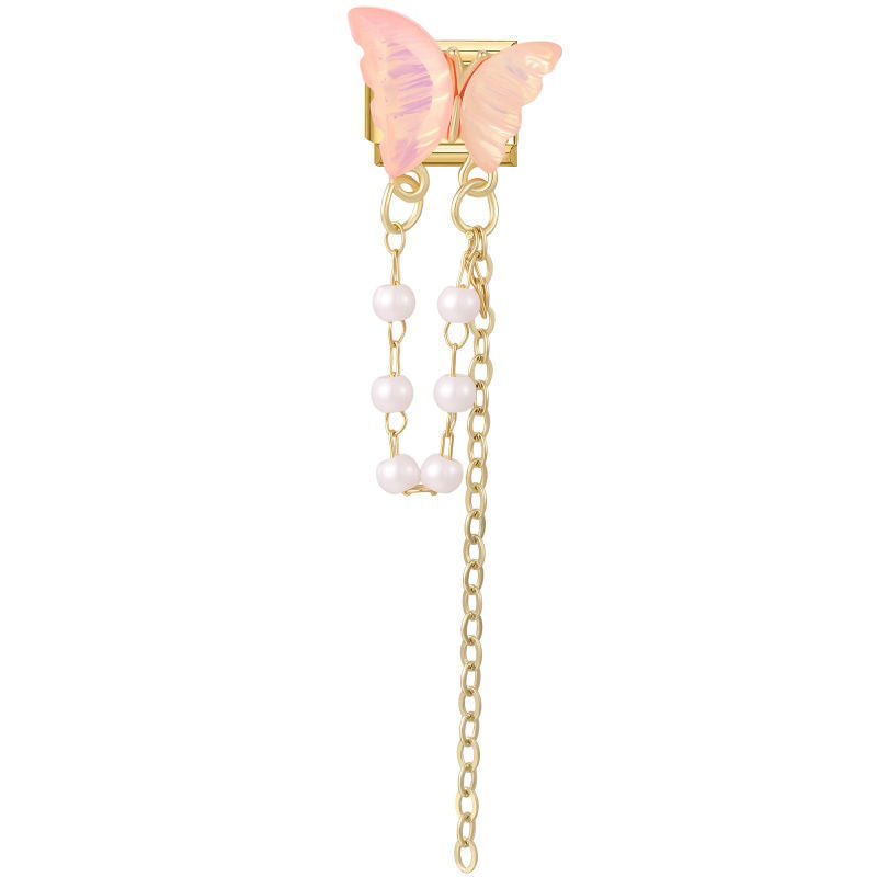 Alas de mariposa rosa con cadenas y perlas colgantes