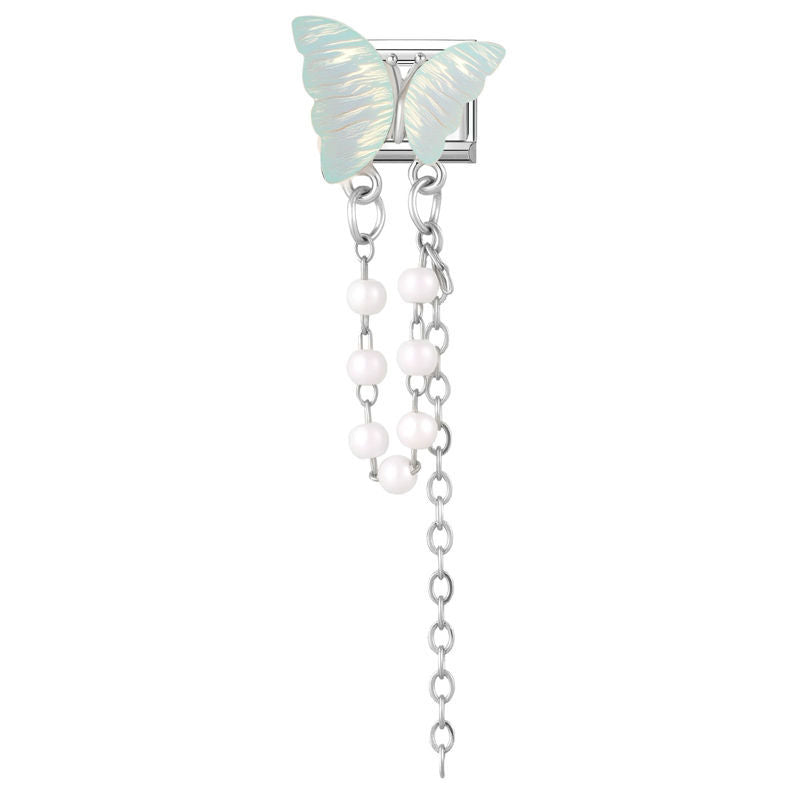 Mariposa iridiscente con perlas colgantes