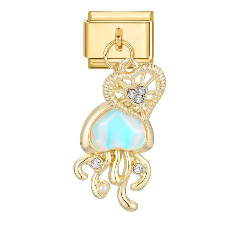 Colgante medusa dorada con piedra iridiscente y corazón de circonitas