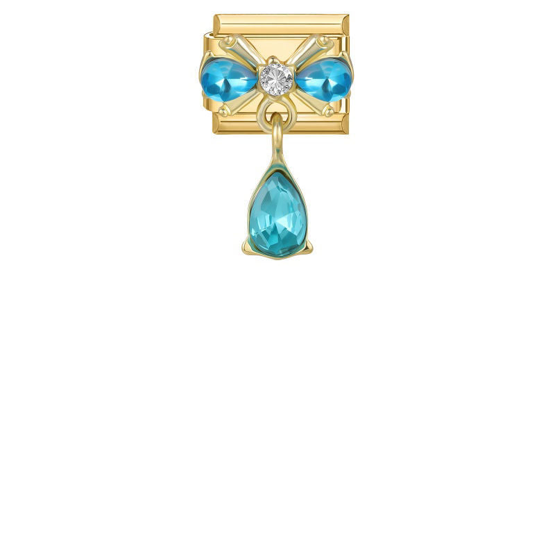 Charm dorado con piedras azules y colgante de gota turquesa