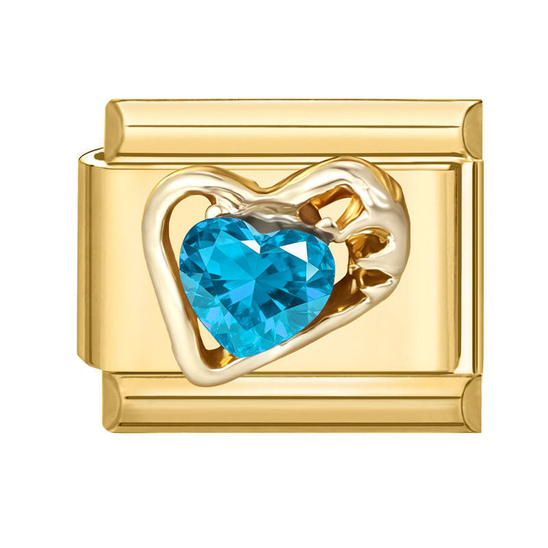 Corazón dorado con circonita azul