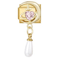 Media luna dorada con piedra rosa en forma de corazón y perla colgante