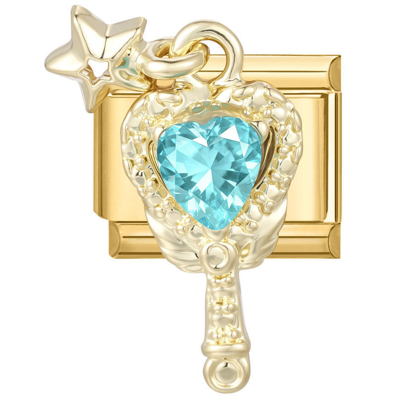 Espejo de mano dorado con piedra azul en forma de corazón y estrella