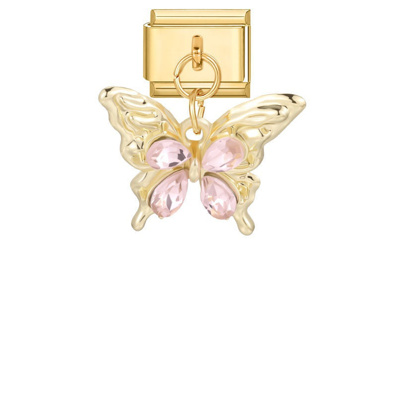 Mariposa dorada con piedras rosas