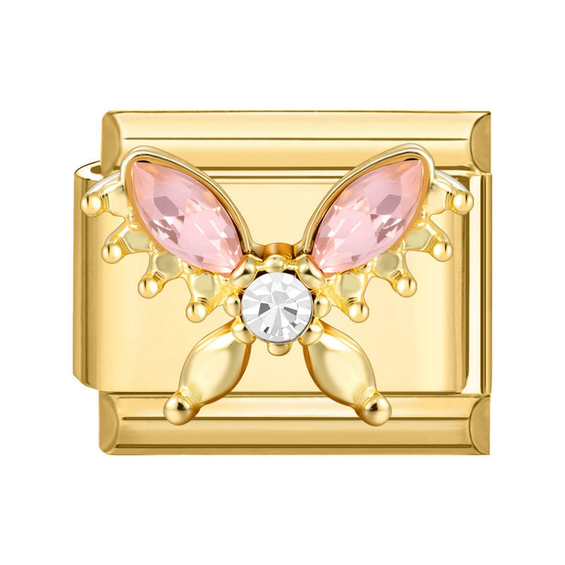 Mariposa dorada con circonitas rosas