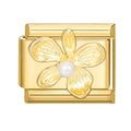 Flor dorada con perla