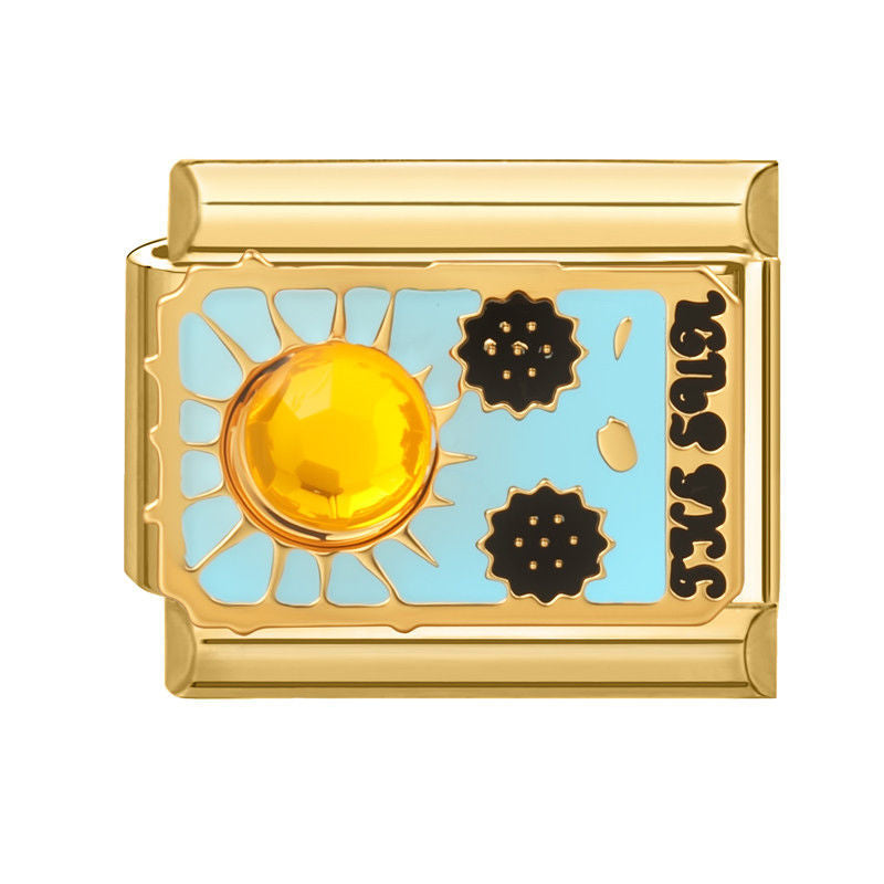 Sol dorado con piedra ámbar y la palabra the sun