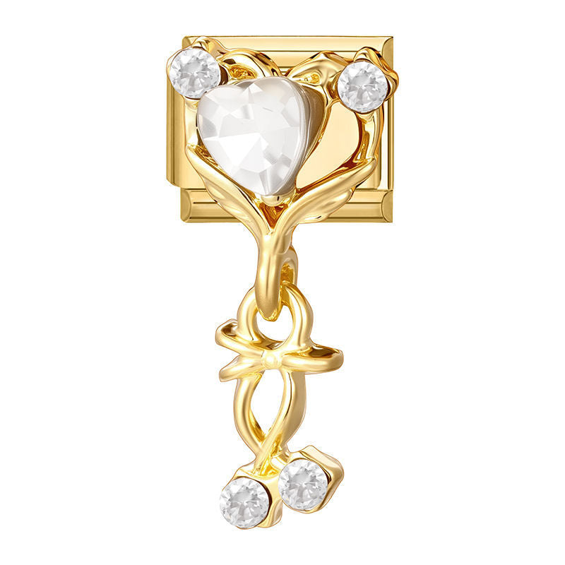 Corazón de cristal con circonitas y lazo colgante