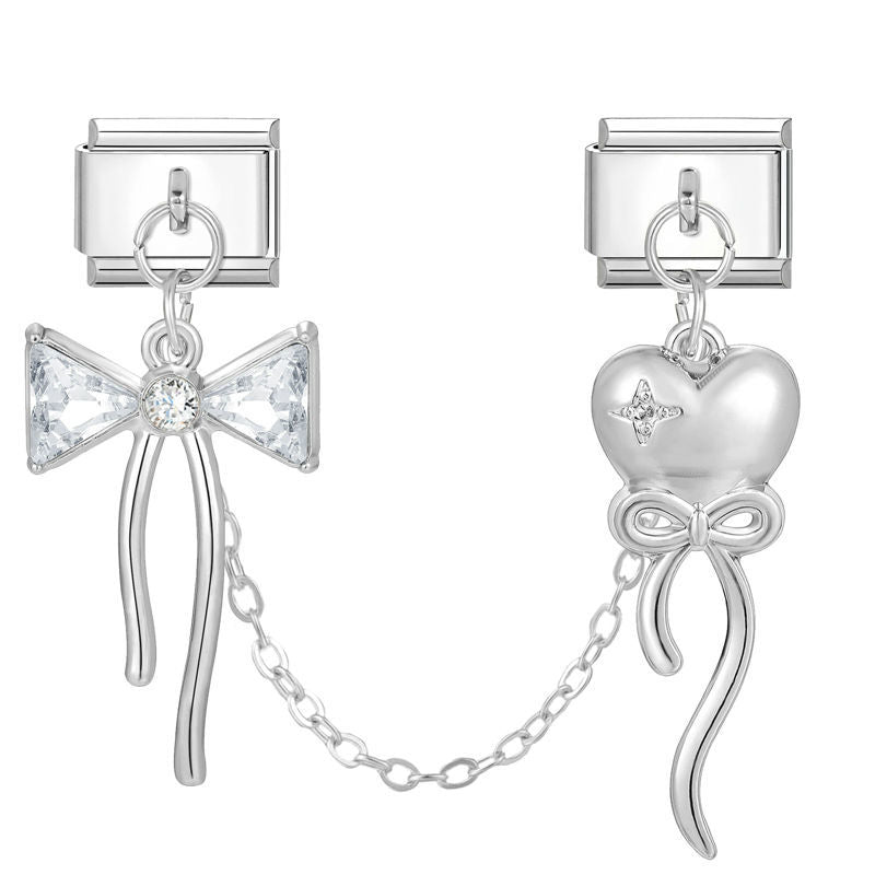 Lazo con circonitas y corazón con lazo con cadena